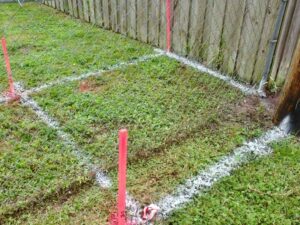 Boundary markers in a residential yard showing how to find my property line